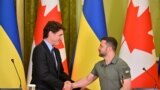 Ukrainian President Volodymyr Zelenskyy and Canadian Prime Minister Justin Trudeau shake hands during a press conference following their talks in Kyiv, June 10, 2023. 