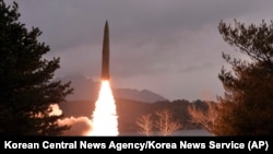 This photo provided by the North Korean government shows what it says is a ballistic missile the country test-fired in North Korea on March 14, 2023.