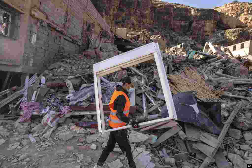 A volunteer helps salvage furniture from homes which were damaged by the earthquake, in the town of Imi N&#39;tala, outside Marrakech, Morocco, Wednesday, September 13, 2023.&nbsp;