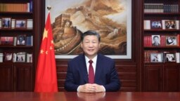 中共官媒新华社发布照片显示，中国领导人习近平在北京发表新年贺词（2023年12月31日）