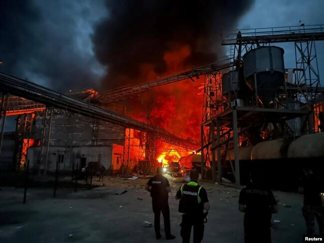 Rescuers work at the site of vegetable oil factory destroyed by Russian missile strike, amid Russia's attack on Ukraine, in Poltava region, Ukraine, Aug. 28, 2023. (Head of Ukraine's Presidential Office Andriy Yermak via Telegram/Handout via Reuters)