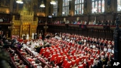 King Charles III reads the King's Speech, as Queen Camilla sits beside him during the State Opening of Parliament in the House of Lords, London, July 17, 2024. 