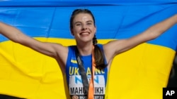 Yaroslava Mahuchikh of Ukraine celebrates after winning the gold medal in the Women's high jump final during the World Athletics Championships in Budapest, Hungary, Aug. 27, 2023.