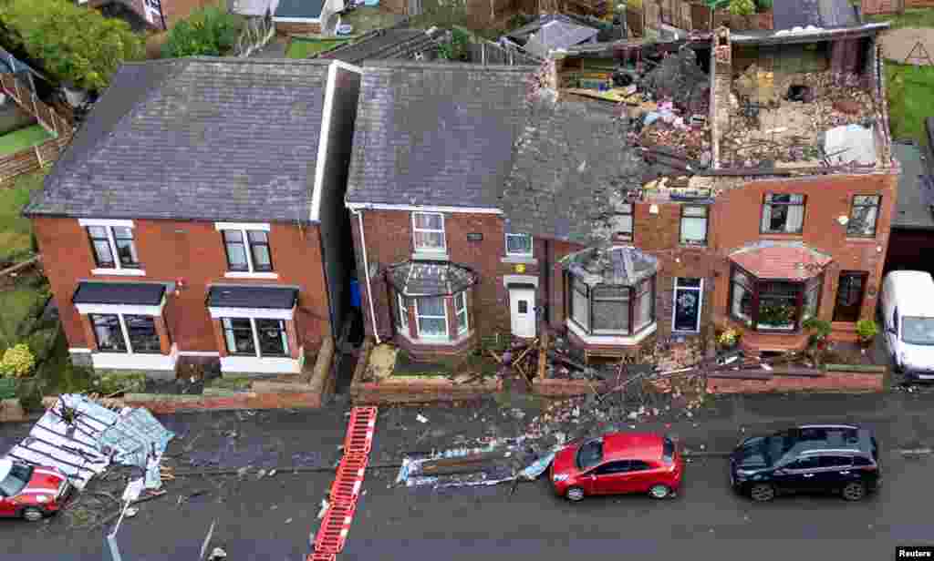 Damage is seen on the roofs of a row of terraced houses after Storm Gerrit hit the country in Stalybridge, Britain.