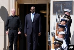 FILE - U.S. Defense Secretary Lloyd Austin, right, and Israeli Defense Minister Yoav Gallant are pictured at an arrival ceremony at the Pentagon in Washington, June 25, 2024. The two spoke by phone about Israel's defense against Hezbollah threats, Gallant said Sept. 19, 2024.