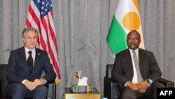 US Secretary of State Antony Blinken, left, meets with Nigerien Foreign Minister Hassoumi Massoudou at the Diori Hamani International Airport in Niamey, Niger, on March 16, 2023.