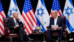 FILE - President Joe Biden and Israeli Prime Minister Benjamin Netanyahu participate in an expanded bilateral meeting with Israeli and U.S. government officials on Wednesday, October 18, 2023, in Tel Aviv. 