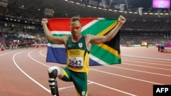 Oscar Pistorius aliposhiriki mashindano ya riadha katika michezo ya walemavu iliyofanyika London mwaka 2012. Picha na IAN KINGTON / AFP.