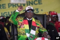 Zimbabwe's President Emmerson Mnangagwa signals to the crowd at a campaign rally in Harare on Aug. 9, 2023. The 80-year-old Mnangagwa is seeking re-election for a second term.