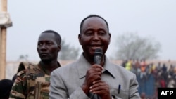 FILE: Former President François Bozizé (R), leader of the Central African opposition party speaks during a rally in Bangui, Central African Republic, on November 24 2020