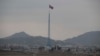 FILE - A North Korean flag flutters in North Korea's village Gijungdong as seen from an South Korea's observation post inside the demilitarized zone in Paju, South Korea, during a media tour, March 3, 2023.