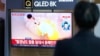 People watch a TV screen reporting North Korea's missile launch with a file image during a news program at the Seoul Railway Station in Seoul, South Korea, March 22, 2023.