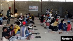 FILE — Ethiopian migrants at an International Organization for Migration shelter in Yemen, April 13, 2021. The IOM, which oversees voluntary humanitarian returns from Yemen, has paused returning migrants from Ethiopia's Tigray and Amhara regions due to the region's insecurity.