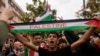 Protesters hold flags and shout slogans gather for a pro-Palestinian rally in Rome, Oct. 21, 2023. 