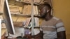 Dicakory Balde, a municipal official, works on the digital civil registry at the archive storage of the Parcelles Assainies town hall in Dakar, Senegal, July 19, 2024.