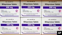 FILE - Boxes of the drug mifepristone sit on a shelf at the West Alabama Women's Center in Tuscaloosa, Ala., on March 16, 2022.