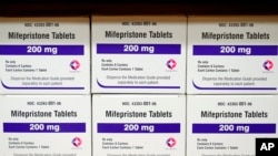 FILE - Boxes of the drug mifepristone sit on a shelf at the West Alabama Women's Center in Tuscaloosa, Ala., on March 16, 2022.