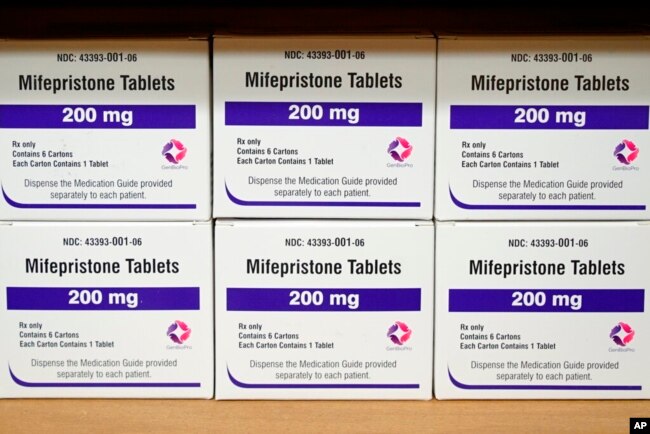 FILE - Boxes of the drug mifepristone sit on a shelf at the West Alabama Women's Center in Tuscaloosa, Ala., on March 16, 2022. . (AP Photo/Allen G. Breed, File)