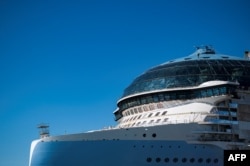 A worker is seen on a roof of the Royal Caribbean's new ship 'Icon of the Seas' which is currently under construction at the Turku shipyard in Finland's southwest coast, May 30, 2023.