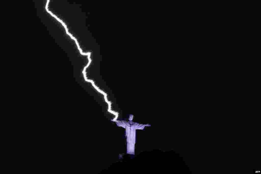 A lightning hits the hand of the Christ the Redeemer statue at the Corcovado mountain in Rio de Janeiro, Brazil, Feb. 21, 2023.