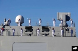 FILE - Chinese sailors wave on approach to Chahbahar, Iran, on the Gulf of Oman, in this photo provided Dec. 27, 2019. This was from the first joint naval drill with Russia, China and Iran in the gulf. Similar drills took place this week. (Iranian army via AP)