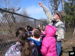 This image provided by Steve Kistler shows Kistler teaching third-graders at the Cub Run, Kentucky, Elementary School about birds during the Great Backyard Bird Count in February 2012. The count is a citizen science project that collects data used by researchers to track bird populations. (Steve Kistler/Janet Kistler via AP)