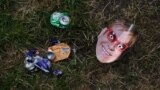 A photograph taken on June 26, 2023, shows a mask picturing British singer and musician Elton John on the ground at the end of the week-long Glastonbury festival in the village of Pilton in Somerset, southwest England. 