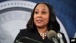 FILE - Georgia Fulton County District Attorney Fani Willis speaks in the Fulton County Government Center during a news conference in Atlanta, Aug. 14, 2023. 