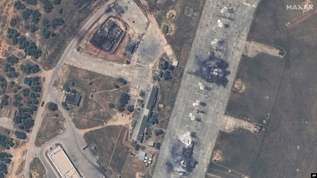 This image shows an overview of destroyed MiG-31 fighter aircraft and a fuel storage facility at Belbek air base, near Sevastopol, in Crimea, May 16, 2024. (Maxar Technologies via AP)