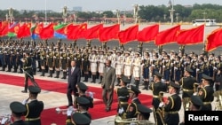 FILE - Chinese President Xi Jinping and Eritrean President Isaias Afwerki attend a welcoming ceremony outside the Great Hall of the People in Beijing, China, May 15, 2023. 