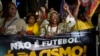 People hold a banner with a message that reads in Portuguese; "It isn't football, it is racism" during a protest against racism suffered by Brazilian soccer star Vinicius Junior who plays for Spain's Real Madrid, in Rio de Janeiro, Brazil, May 25, 2023.