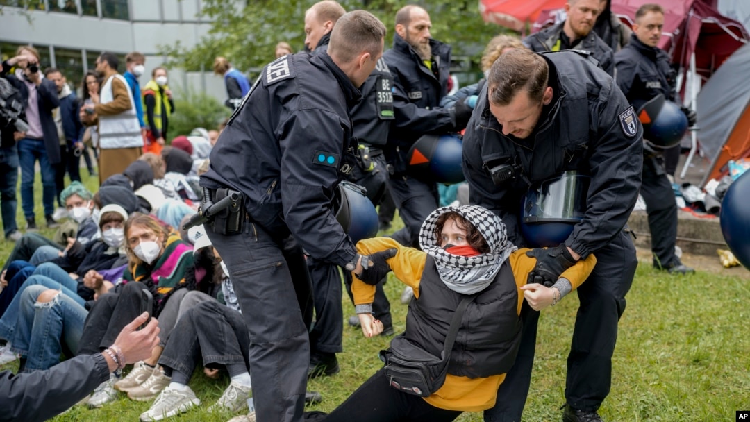 A protester is dragged away by police officers during a pro-Palestinians demonstration on the campus of Berlin's Free University, in Berlin, Germany, May 7, 2024.