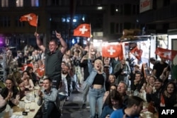 Supporters in Biel, Switzerland, react on May 12, 2024, after Swiss singer Nemo won the final of the 68th Eurovision Song Contest 2024. Nemo Mettler was born in the city.