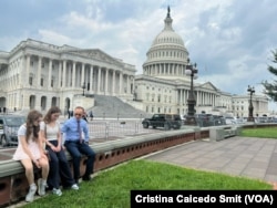 After several days of media interviews and advocacy meetings in Washington, Pavel Butorin, right, and his daughters, 12-year-old Miriam, left, and 16-year-old Bibi, center, sit outside the Capitol on July 25, 2024.