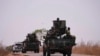 Nigerian army troops patrol near LEA Primary and Secondary School Kuriga where students were kidnapped in Kuriga, Kaduna, Nigeria, March 9, 2024. 