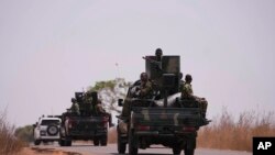 Nigerian army troops patrol near LEA Primary and Secondary School Kuriga where students were kidnapped in Kuriga, Kaduna, Nigeria, March 9, 2024. 