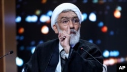 Presidential candidate Mostafa Pourmohammadi speaks in a debate of the candidates at the TV studio in Tehran, Iran, June 17, 2024, in this picture made available by Iranian state-run TV, IRIB.