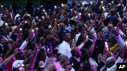 An audience shows appreciation with flashlights as Rapper Doug E. Fresh performs during a Juneteenth concert on the South Lawn of the White House in Washington, June 10, 2024. Many Americans people celebrate Juneteenth by honoring African American culture through arts and music.