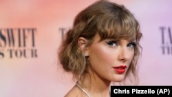 FILE- Taylor Swift arrives at the world premiere of the concert film "Taylor Swift: The Eras Tour," Oct. 11, 2023, at AMC The Grove 14 in Los Angeles.