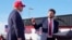 FILE - Sen. J.D. Vance, right, points toward Republican presidential candidate former President Donald Trump at a campaign rally, March 16, 2024, in Vandalia, Ohio. Trump on Monday picked Vance as his running mate.