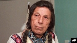 FILE - Iron Eyes Cody, an actor whose tearful face in 1970s TV commercials became a powerful symbol of the anti-littering campaign, is pictured in this 1986 photo. The rights of the ad have been transferred to the National Congress of American Indians, which is retiring it.