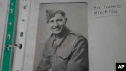 A copy of a photograph of Mervyn Kersh, a D-Day veteran who fought in the Normandy campaign, in his uniform.