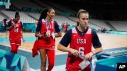 Sabrina Ionescu (6), A'ja Wilson (9) and Alyssa Thomas, walk off the court after the United States women's team practiced before the start of the 2024 Summer Olympics, July 25, 2024 in Villeneuve-d'Ascq, France.