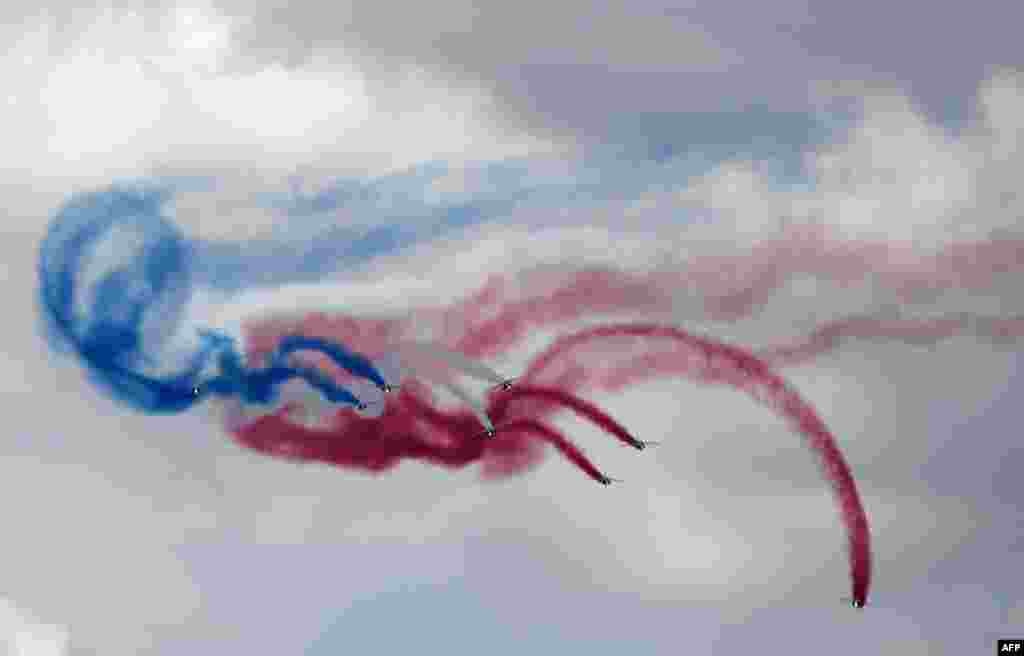 The French Air and Space Force demonstration unit 'Patrouille de France' performs aerobatics during the International Paris Air Show.