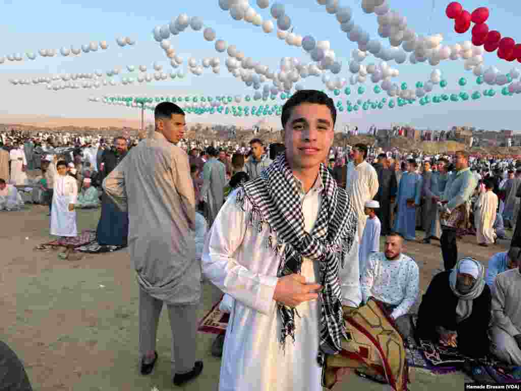 &ldquo;I&rsquo;m sure when my Palestinian friends on Facebook see me taking a photo with the keffiyeh and these balloons, they&rsquo;ll know we care about them, too,&rdquo; says Mohamed, a high school student. Abusir, Egypt, April 10, 2024.