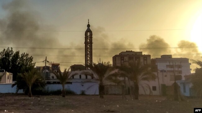 Smoke rises above buildings in southern Khartoum, as violence between two rival Sudanese generals continues, on May 17, 2023.