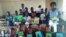 Vana vepa Dekezi Primary School vachiratidza mabhuku avakapihwa neRural Schools Library Trust