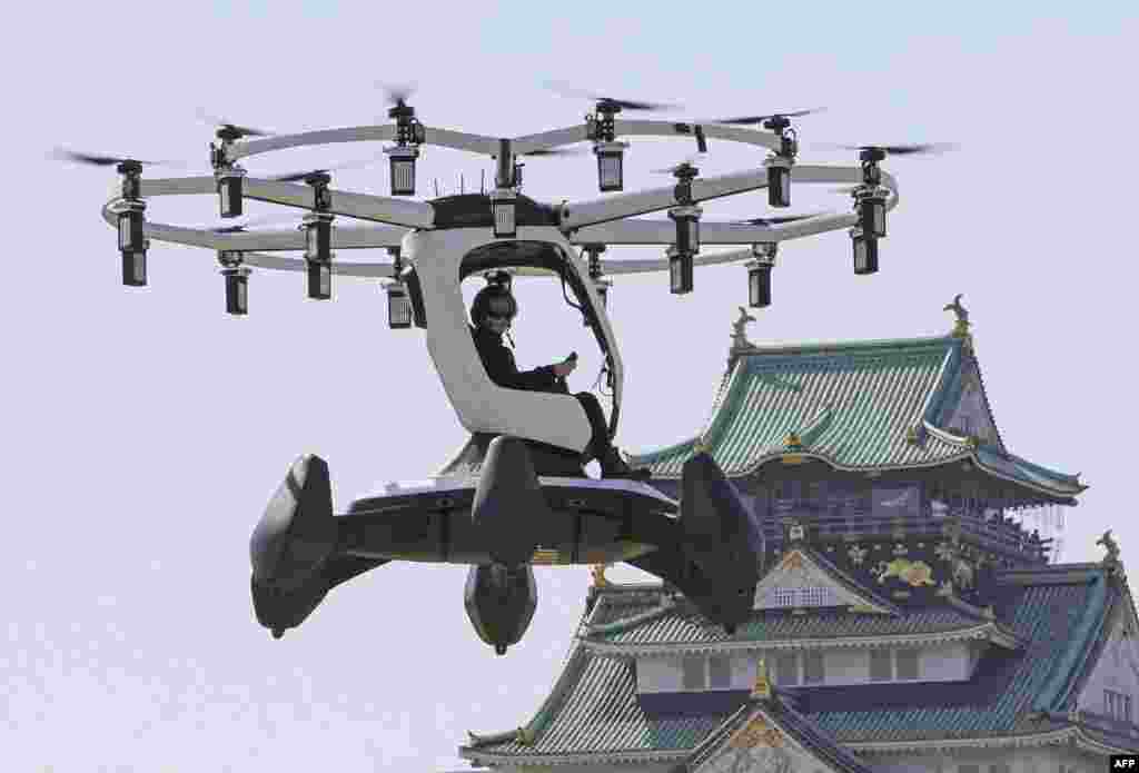 A pilot demonstrates an aircraft manufactured by U.S.-based LIFT Aircraft in front of Osaka Castle in Osaka, Japan.