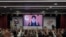 FILE - Supporters of the Iranian-backed Hezbollah group listen to a speech by Hezbollah leader Sayyed Hassan Nasrallah speaking via a video link, in the southern suburbs of Beirut, May 14, 2024.