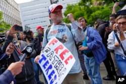 A supporter of Donald Trump reacts to the guilty verdict announced against the former president outside Manhattan Criminal Court, May 30, 2024, in New York. Trump became the first former president to be convicted of felony crimes.